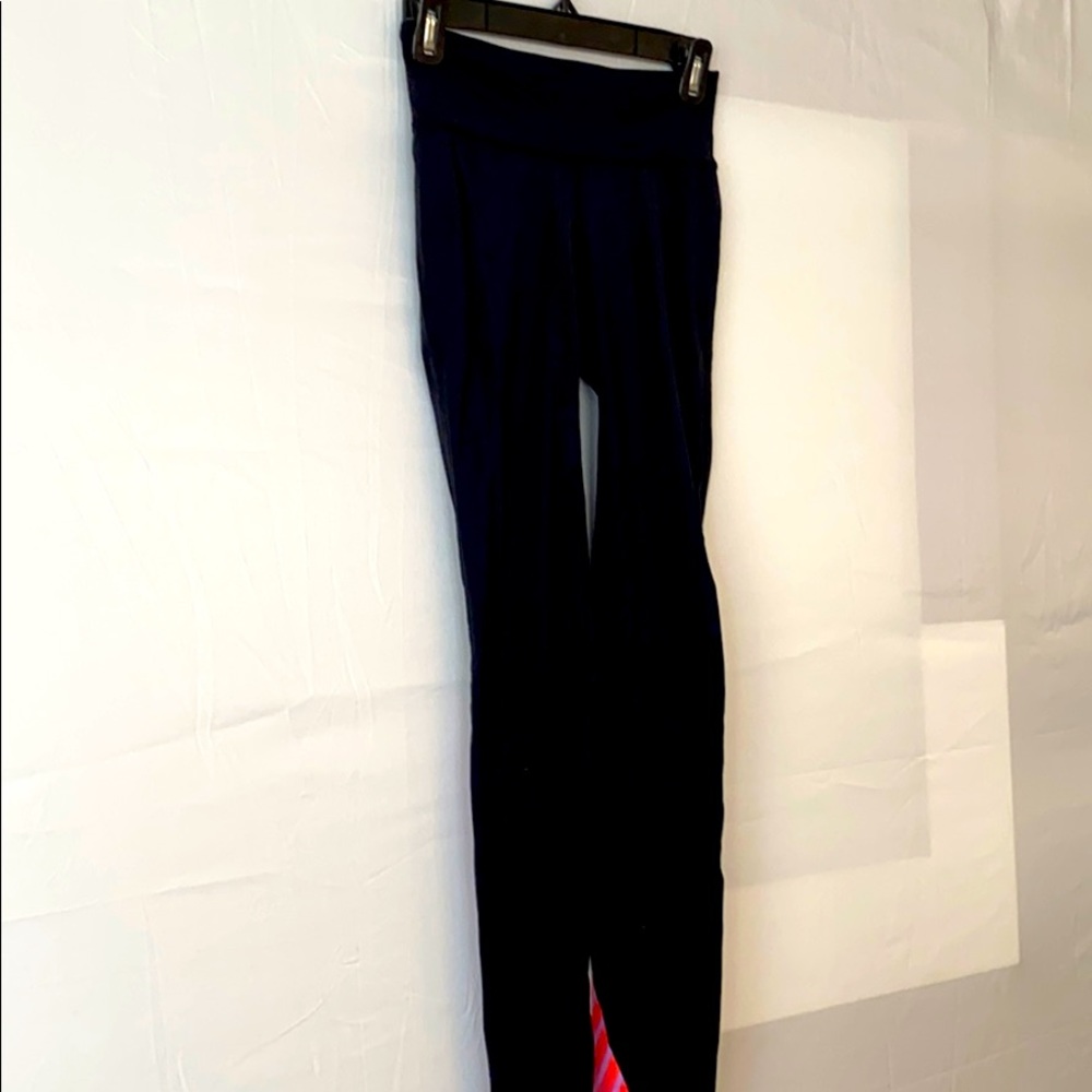 Gap leggings with pink and purple design on calf